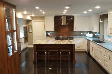 Large transitional dark wood floor eat-in kitchen photo in Chicago with an undermount sink, shaker cabinets, white cabinets, quartzite countertops, brown backsplash, glass tile backsplash, stainless steel appliances and an island