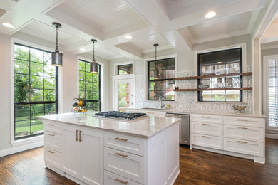 Inspiration for a transitional dark wood floor kitchen remodel in Dallas with white cabinets, stainless steel appliances, an island, an undermount sink, shaker cabinets and multicolored backsplash