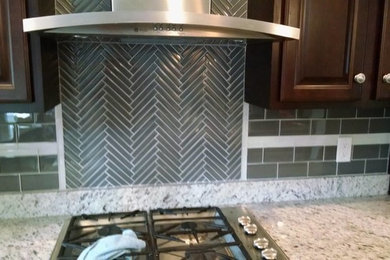 Kitchen - modern kitchen idea in Baltimore with gray backsplash, glass tile backsplash and stainless steel appliances