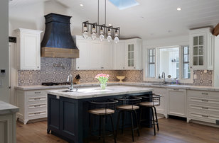 Example of a large country u-shaped dark wood floor and brown floor kitchen design in San Francisco with an undermount sink, multicolored backsplash, cement tile backsplash, paneled appliances, beaded inset cabinets, white cabinets, marble countertops, an island and white countertops