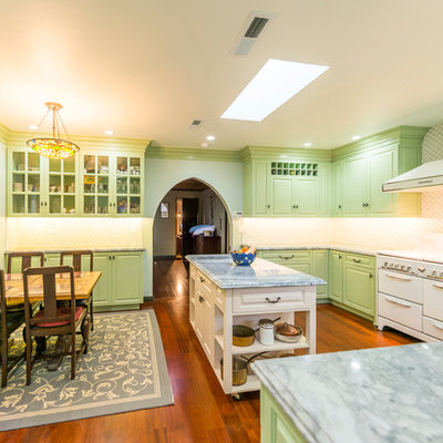 Inspiration for a timeless u-shaped eat-in kitchen remodel in Los Angeles with green cabinets and white appliances