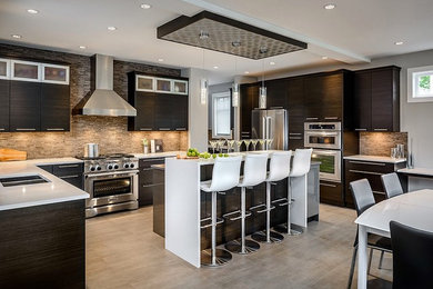 Large trendy u-shaped porcelain tile and gray floor eat-in kitchen photo in Los Angeles with a double-bowl sink, flat-panel cabinets, dark wood cabinets, quartz countertops, multicolored backsplash, matchstick tile backsplash, stainless steel appliances, an island and white countertops