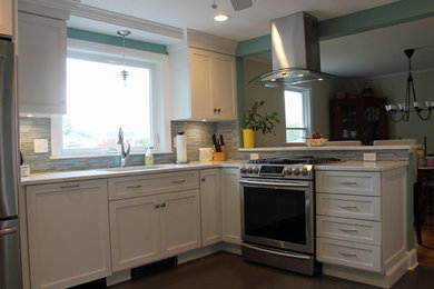 Small beach style l-shaped eat-in kitchen photo in Other with shaker cabinets, white cabinets and quartz countertops