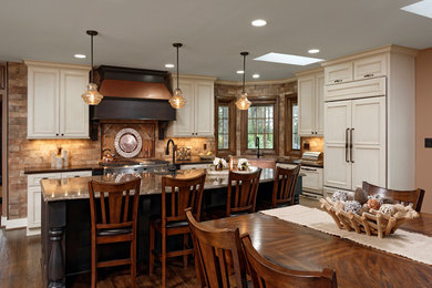 Kitchen - traditional kitchen idea in DC Metro with a farmhouse sink, quartz countertops and an island