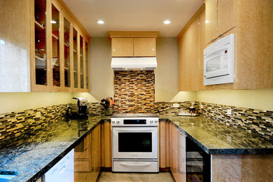 Mid-sized trendy galley ceramic tile eat-in kitchen photo in Los Angeles with an undermount sink, flat-panel cabinets, light wood cabinets, solid surface countertops, metallic backsplash, matchstick tile backsplash, white appliances and no island