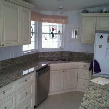 Kitchen Cabinets Cream Color and Granite Countertop