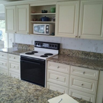 Kitchen Cabinets Cream Color and Granite Countertop