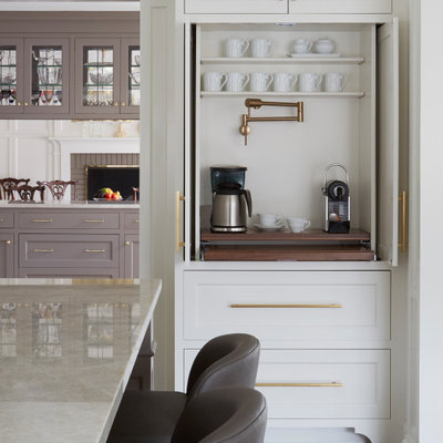 Example of a large transitional l-shaped medium tone wood floor and brown floor open concept kitchen design in Chicago with an undermount sink, recessed-panel cabinets, white cabinets, marble countertops, white backsplash, ceramic backsplash, stainless steel appliances, an island and beige countertops