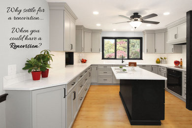 Enclosed kitchen - large transitional u-shaped light wood floor and brown floor enclosed kitchen idea in Boston with a double-bowl sink, shaker cabinets, gray cabinets, quartz countertops, white backsplash, porcelain backsplash, black appliances, an island and white countertops