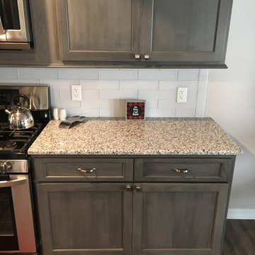Kitchen counters, cabinets + flooring remodel