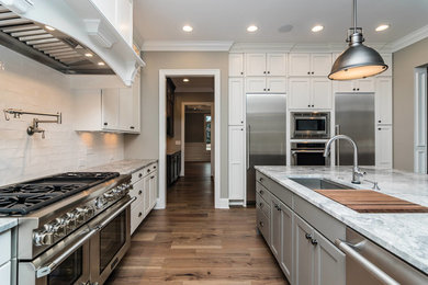 Large eat-in kitchen photo in Raleigh with granite countertops and an island
