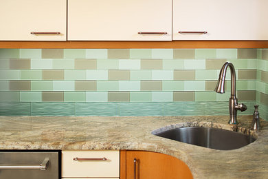 Kitchen - modern vinyl floor kitchen idea in New York with granite countertops and glass tile backsplash