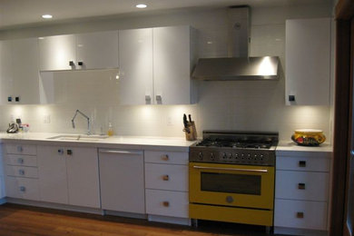 Example of a trendy kitchen design in Vancouver with colored appliances