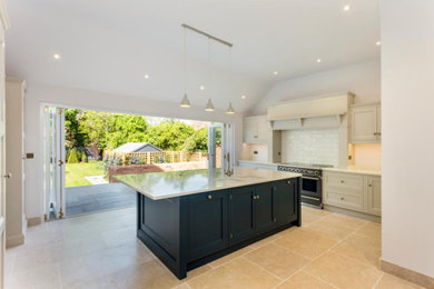 Large contemporary kitchen/diner in Oxfordshire with composite countertops and an island.