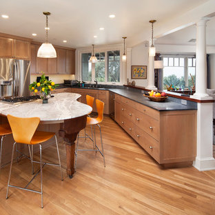 Example of a mid-sized transitional u-shaped light wood floor and beige floor eat-in kitchen design in Santa Barbara with an undermount sink, light wood cabinets, marble countertops, stainless steel appliances, an island and shaker cabinets