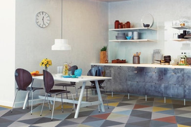 Example of a mid-sized minimalist galley cement tile floor eat-in kitchen design in New York with shaker cabinets, white cabinets, concrete countertops, blue backsplash, marble backsplash and no island