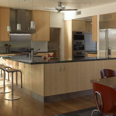 Kitchen - contemporary kitchen idea in San Francisco with flat-panel cabinets, light wood cabinets, metallic backsplash, metal backsplash and stainless steel appliances