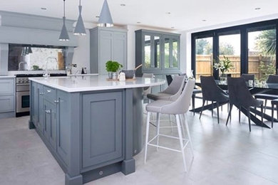 Design ideas for a contemporary kitchen in Kent with shaker cabinets, grey cabinets, marble worktops, ceramic flooring, an island and grey floors.