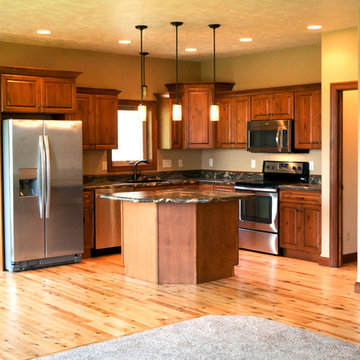 Kitchen features open layout and walk-in pantry with rain glass