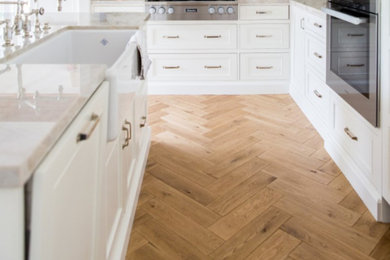 Kitchen - country light wood floor kitchen idea in Tampa with an island