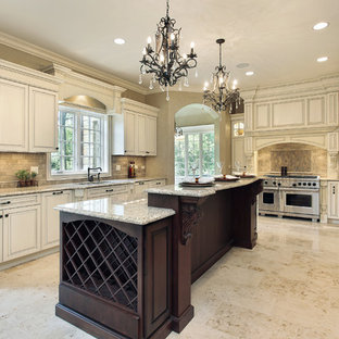 Inspiration for a large traditional u-shaped kitchen pantry in New York with an undermount sink, open cabinets, beige cabinets, granite benchtops, multi-coloured splashback, slate splashback, stainless steel appliances, multiple islands and beige floor.