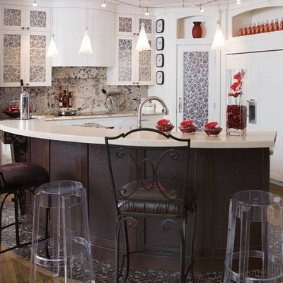 Mid-sized eclectic u-shaped medium tone wood floor and beige floor enclosed kitchen photo in Calgary with a double-bowl sink, recessed-panel cabinets, white cabinets, granite countertops, beige backsplash, stone slab backsplash, stainless steel appliances and an island