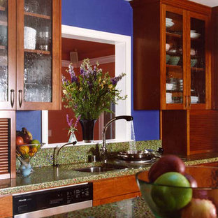 Photo of a traditional kitchen in San Francisco with glass-front cabinets, dark wood cabinets and recycled glass benchtops.
