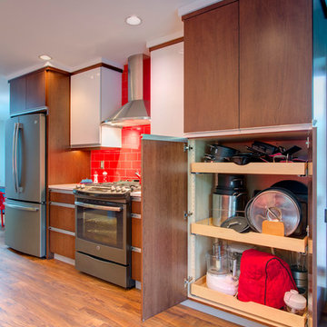 Kitchen has a huge pan & appliance storage cabinet