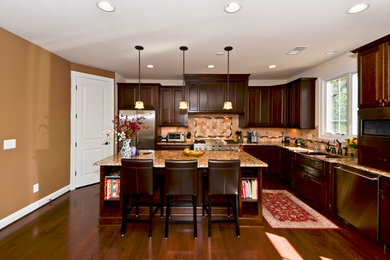 Large trendy l-shaped dark wood floor eat-in kitchen photo in DC Metro with an undermount sink, raised-panel cabinets, dark wood cabinets, granite countertops, multicolored backsplash, stone tile backsplash, stainless steel appliances and an island