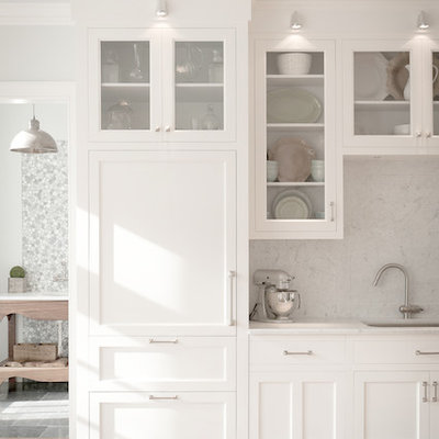 Example of a classic kitchen design in New York with glass-front cabinets, an undermount sink, white cabinets, white backsplash, stone slab backsplash and paneled appliances