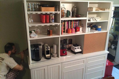 Photo of a medium sized classic single-wall kitchen pantry in New York with wood worktops and white appliances.