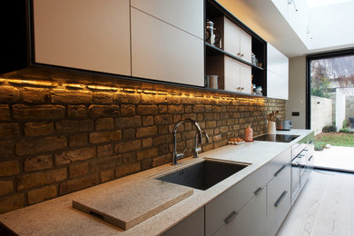 Kitchen in Brass, Granite and polished paint