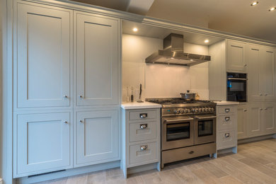 Inspiration for a l-shaped kitchen/diner in Cheshire with shaker cabinets.
