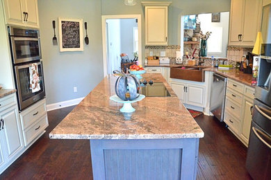 Inspiration for a cottage eat-in kitchen remodel in Charlotte with a farmhouse sink and an island