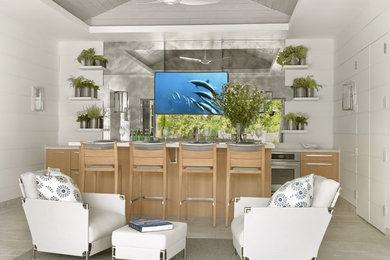 Enclosed kitchen - mid-sized contemporary galley enclosed kitchen idea in St Louis with a double-bowl sink, flat-panel cabinets, light wood cabinets, quartzite countertops, white backsplash, stainless steel appliances and an island