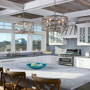 Inspiration for a mid-sized contemporary l-shaped gray floor enclosed kitchen remodel in Portland Maine with an undermount sink, beaded inset cabinets, white cabinets, quartzite countertops, blue backsplash, metal backsplash, stainless steel appliances and an island