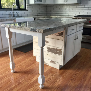 Kitchen Island with reclaimed wood accent.