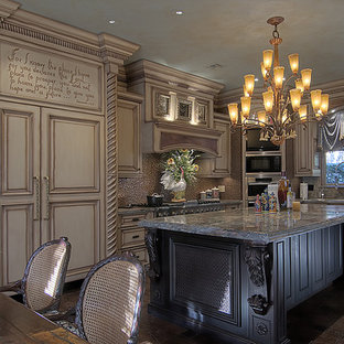 Large mediterranean u-shaped eat-in kitchen in Austin with a triple-bowl sink, recessed-panel cabinets, beige cabinets, granite benchtops, grey splashback, stone slab splashback, stainless steel appliances, ceramic floors, with island and brown floor.
