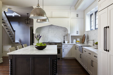 Example of a large transitional l-shaped dark wood floor and brown floor open concept kitchen design in Philadelphia with a farmhouse sink, shaker cabinets, white cabinets, marble countertops, gray backsplash, marble backsplash, paneled appliances and an island