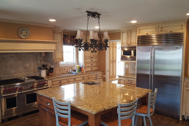 Inspiration for a transitional kitchen remodel in Milwaukee with an island