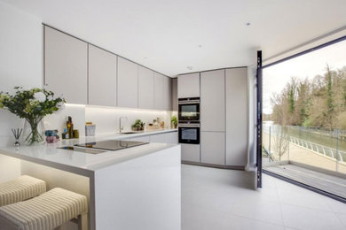 This is an example of a small traditional l-shaped kitchen in London.
