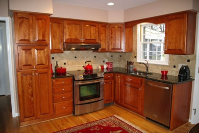 Inspiration for a l-shaped kitchen remodel in Philadelphia with flat-panel cabinets and medium tone wood cabinets