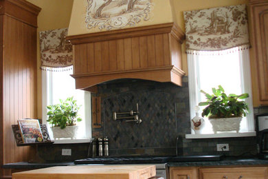 Example of a mid-sized classic u-shaped ceramic tile eat-in kitchen design in New York with raised-panel cabinets, solid surface countertops, gray backsplash, mosaic tile backsplash, stainless steel appliances, an island and medium tone wood cabinets