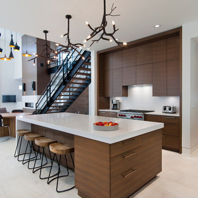 Trendy open concept kitchen photo in Vancouver with flat-panel cabinets, medium tone wood cabinets and stainless steel appliances