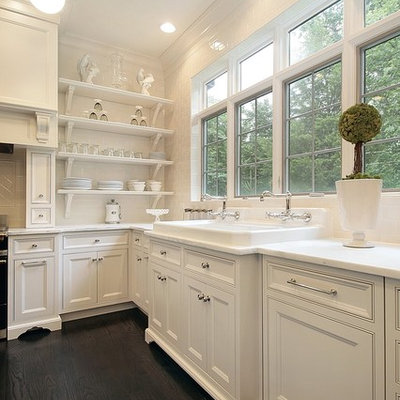 Eat-in kitchen - traditional eat-in kitchen idea in Chicago with a drop-in sink, white cabinets, marble countertops, white backsplash, subway tile backsplash and beaded inset cabinets