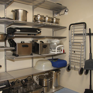 Kitchen pantry features Elfa shelving and accessories