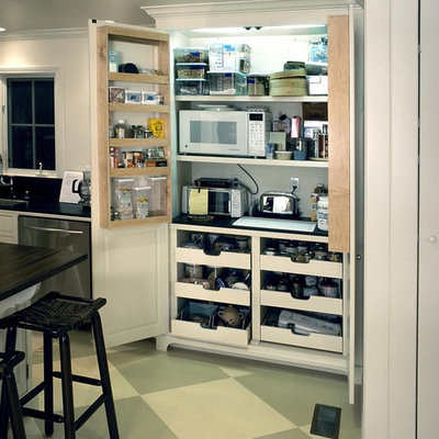 Elegant kitchen photo in Los Angeles with white cabinets and stainless steel appliances