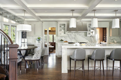 Classic galley kitchen/diner in New York with a submerged sink, glass-front cabinets, white cabinets, white splashback, stone slab splashback and marble worktops.