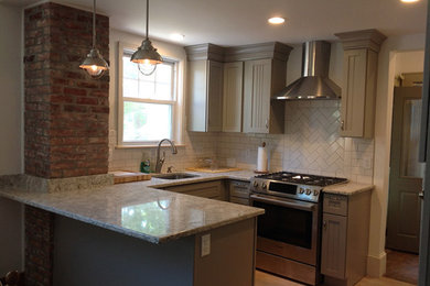 Example of a small minimalist l-shaped medium tone wood floor and beige floor eat-in kitchen design in Boston with a single-bowl sink, shaker cabinets, gray cabinets, granite countertops, white backsplash, cement tile backsplash and stainless steel appliances