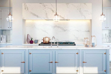Mid-sized trendy galley medium tone wood floor and gray floor enclosed kitchen photo in Montreal with an undermount sink, shaker cabinets, blue cabinets, quartzite countertops, multicolored backsplash, stone slab backsplash and no island